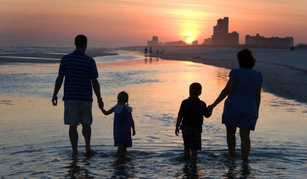A joyful family enjoying a boat tour with beach adventure